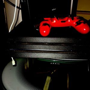 PS4 pro COMES WITH 2 controllers a all black one and a RED Army one